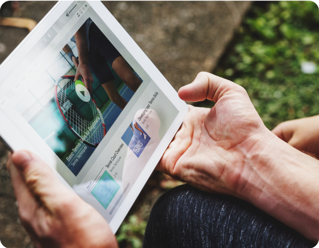 hands holding a tablet