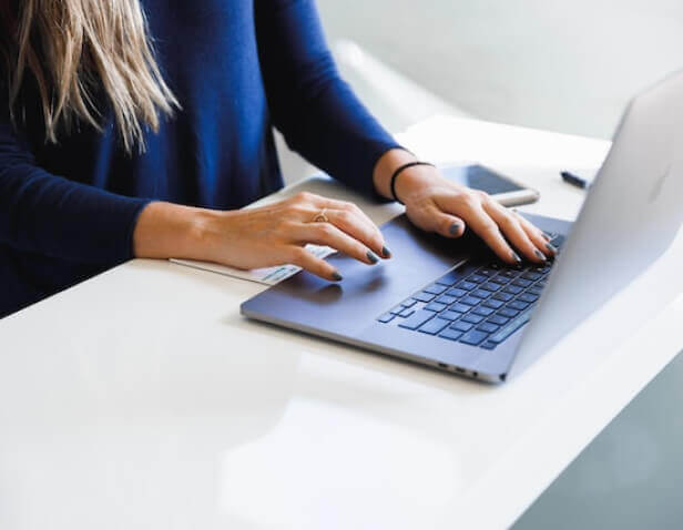 Woman uses a laptop