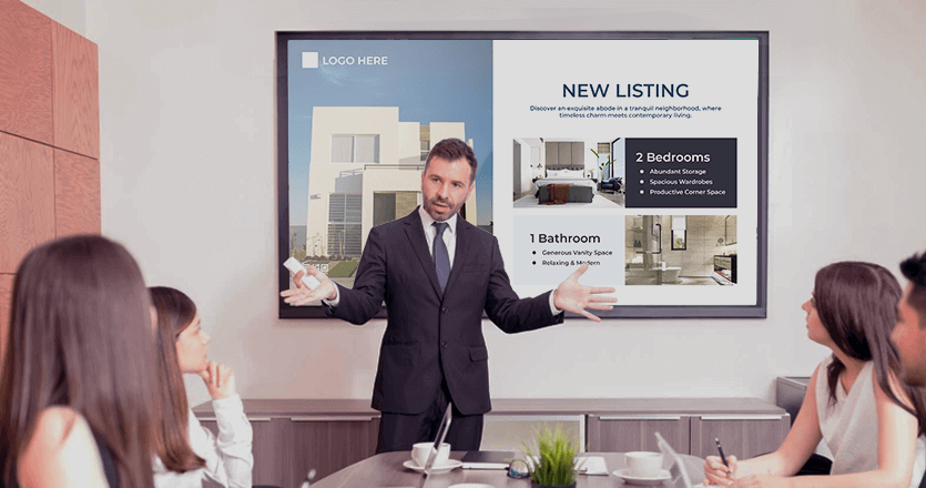 Real estate office with workers and a digital signage screen on the background