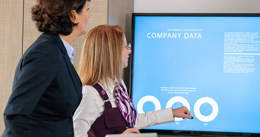 Interactive display with two women in front of it