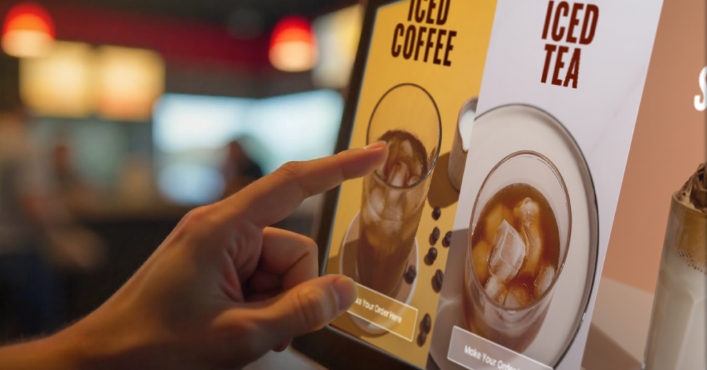 A person interacts with a digital touchscreen menu